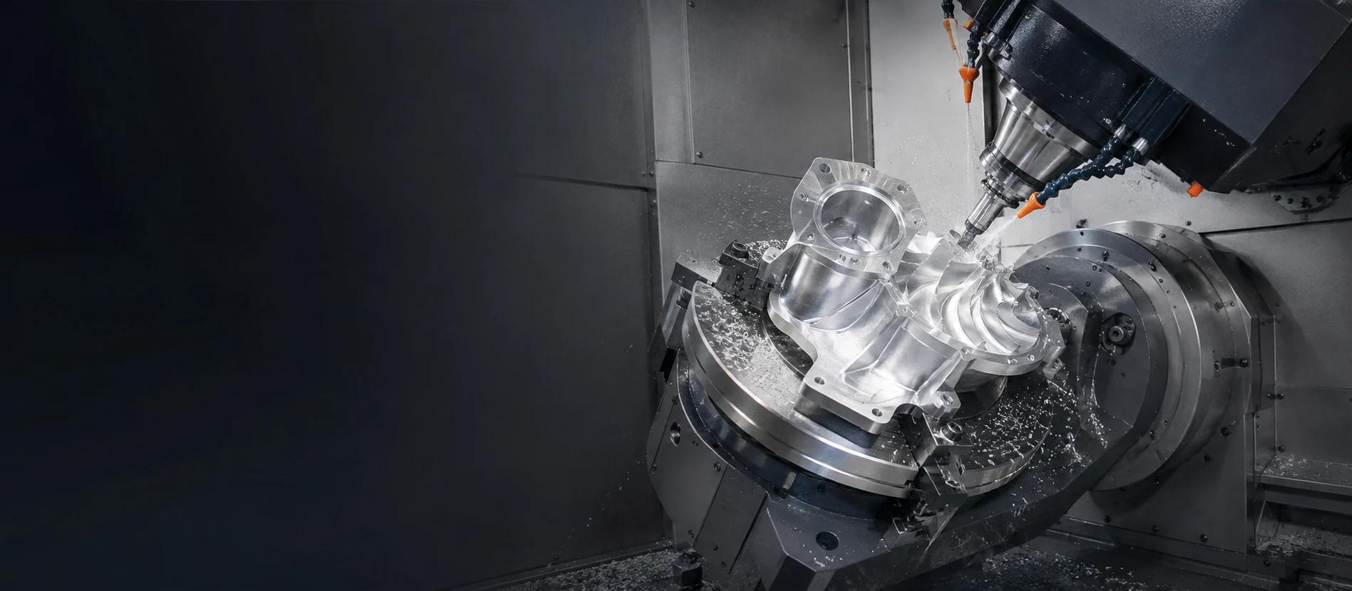 Bright five-axis machine cutting a complex component