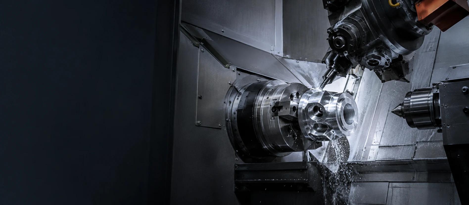 Multi-axis CNC machine producing a complex component